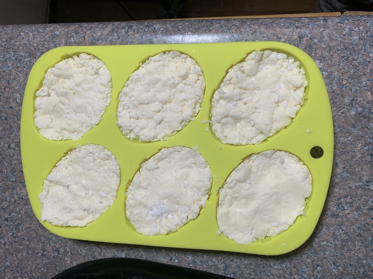 adding the coconut cream mixture to the molds